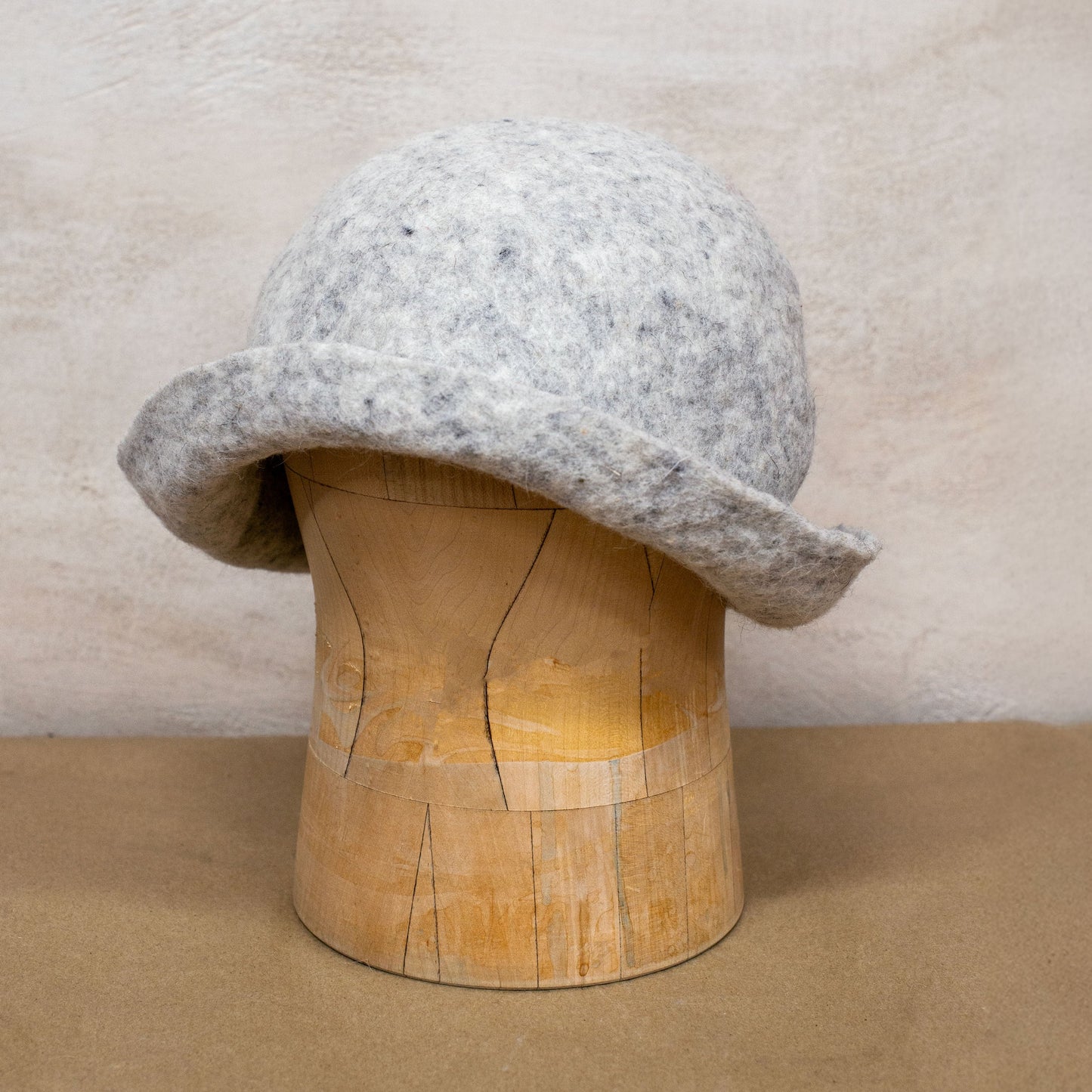 Handmade felted wool sauna hat made from 100% natural wool. Designed to protect your head during sauna, ice bath, or outdoor hot spring use. Oversized fit, breathable, with foldable brim for added comfort and warmth. Minimalist design suits any style.