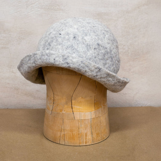 Handmade felted wool sauna hat made from 100% natural wool. Designed to protect your head during sauna, ice bath, or outdoor hot spring use. Oversized fit, breathable, with foldable brim for added comfort and warmth. Minimalist design suits any style.