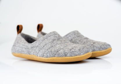 Undyed Grey Natural Wool Slippers for Women with leather loops to pull them on.