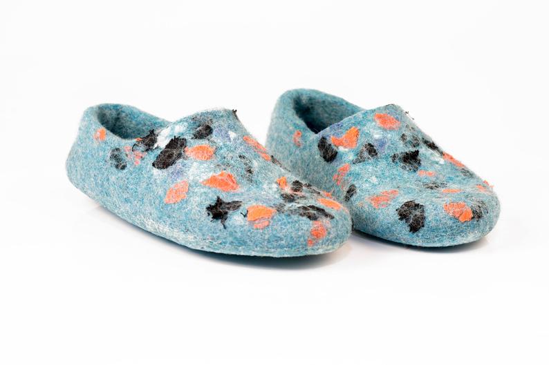 Handmade woolen slippers with natural linen decoration