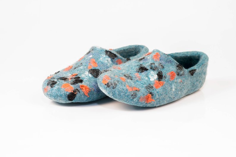 Handmade woolen slippers with natural linen decoration